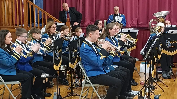 Young cornet players from the training band performing in a concert.