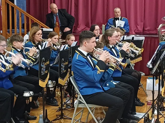The cornet players of the training band performing in a concert.